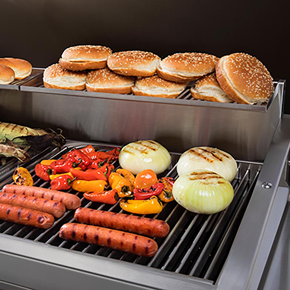 Rectangular warming rack with parallel metal bars inside a grill for warming food.