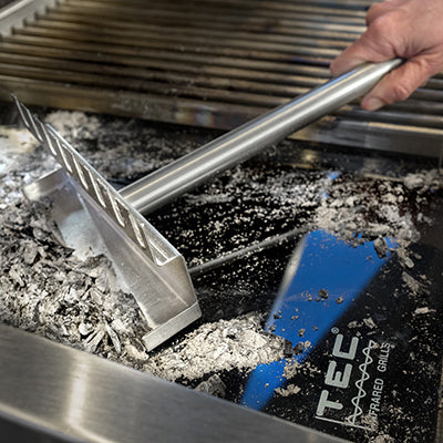 Stainless steel grill grate cleaning tool with long handle and angled scraper