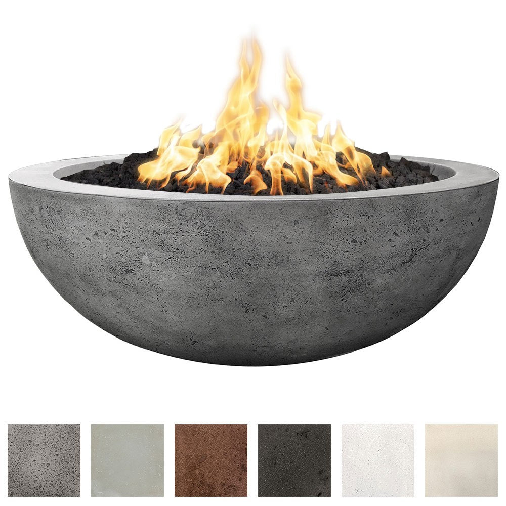 Modern round concrete gas fire pit with open flame and black lava rocks
