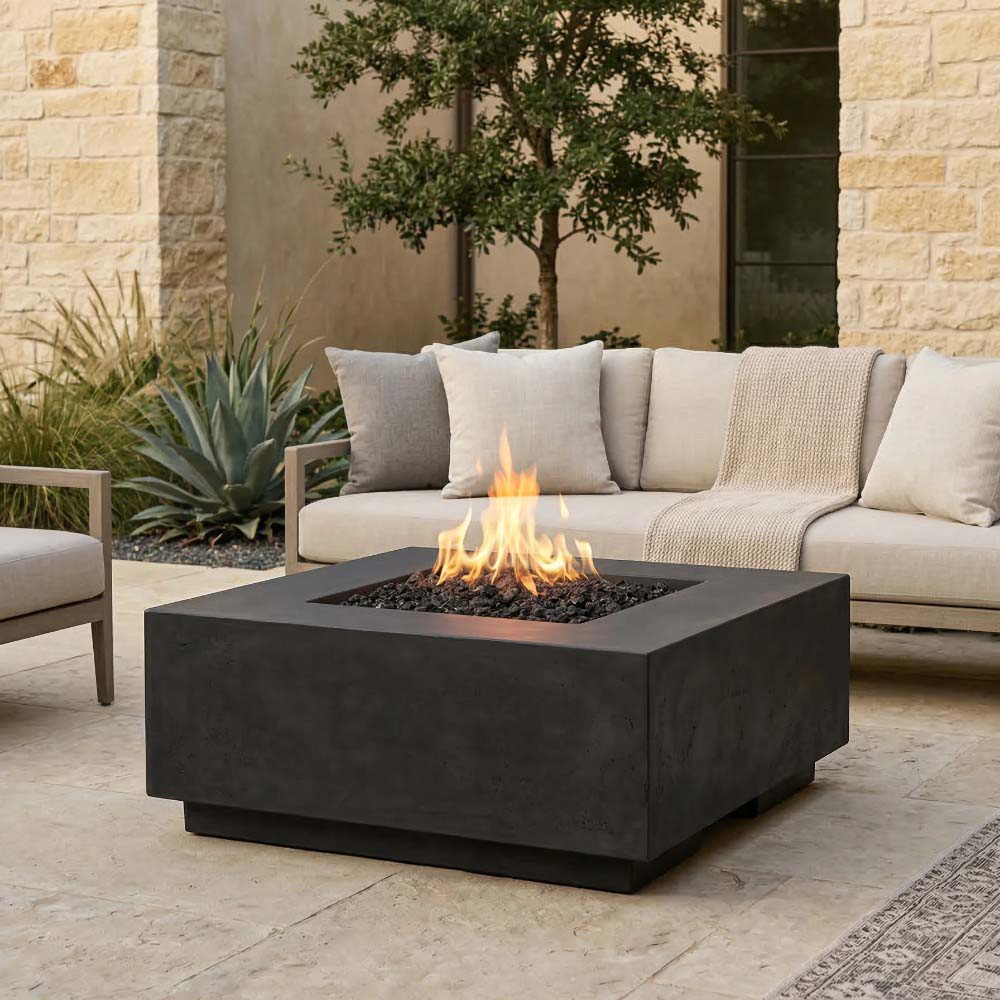 Dark gray concrete gas fire pit with visible flame and black burner insert.