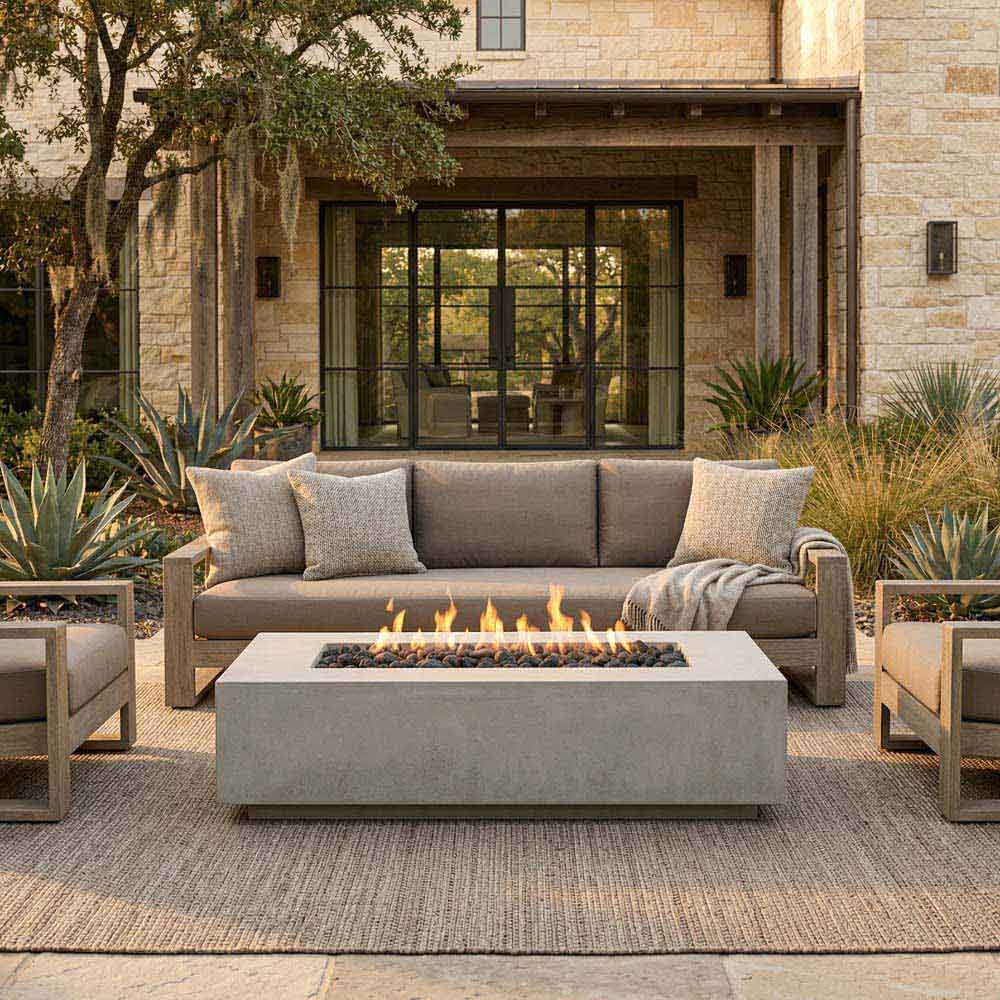 Concrete slim gas fire pit with open flame in front patio seating