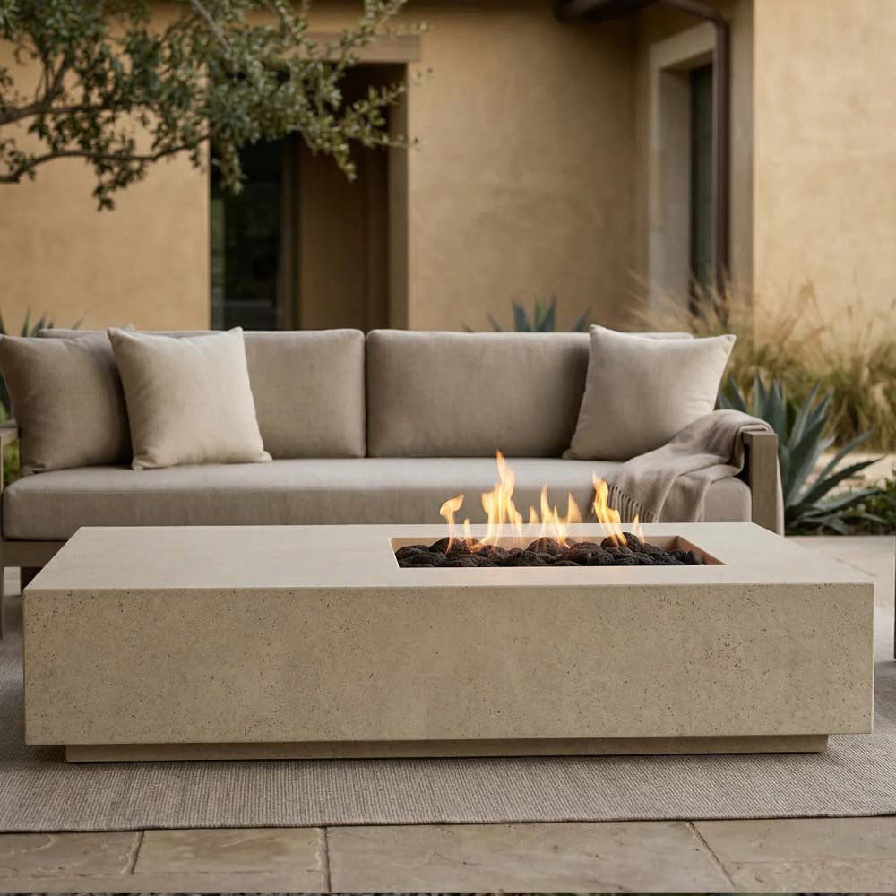 Concrete gas fire pit in natural finish with flames in square burner opening