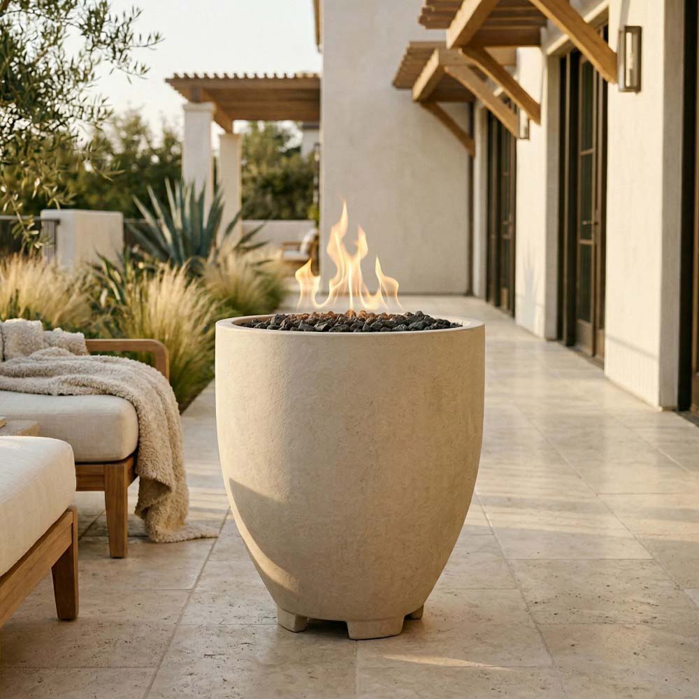 Beige concrete gas fire pit with flame, tapered round bowl on feet
