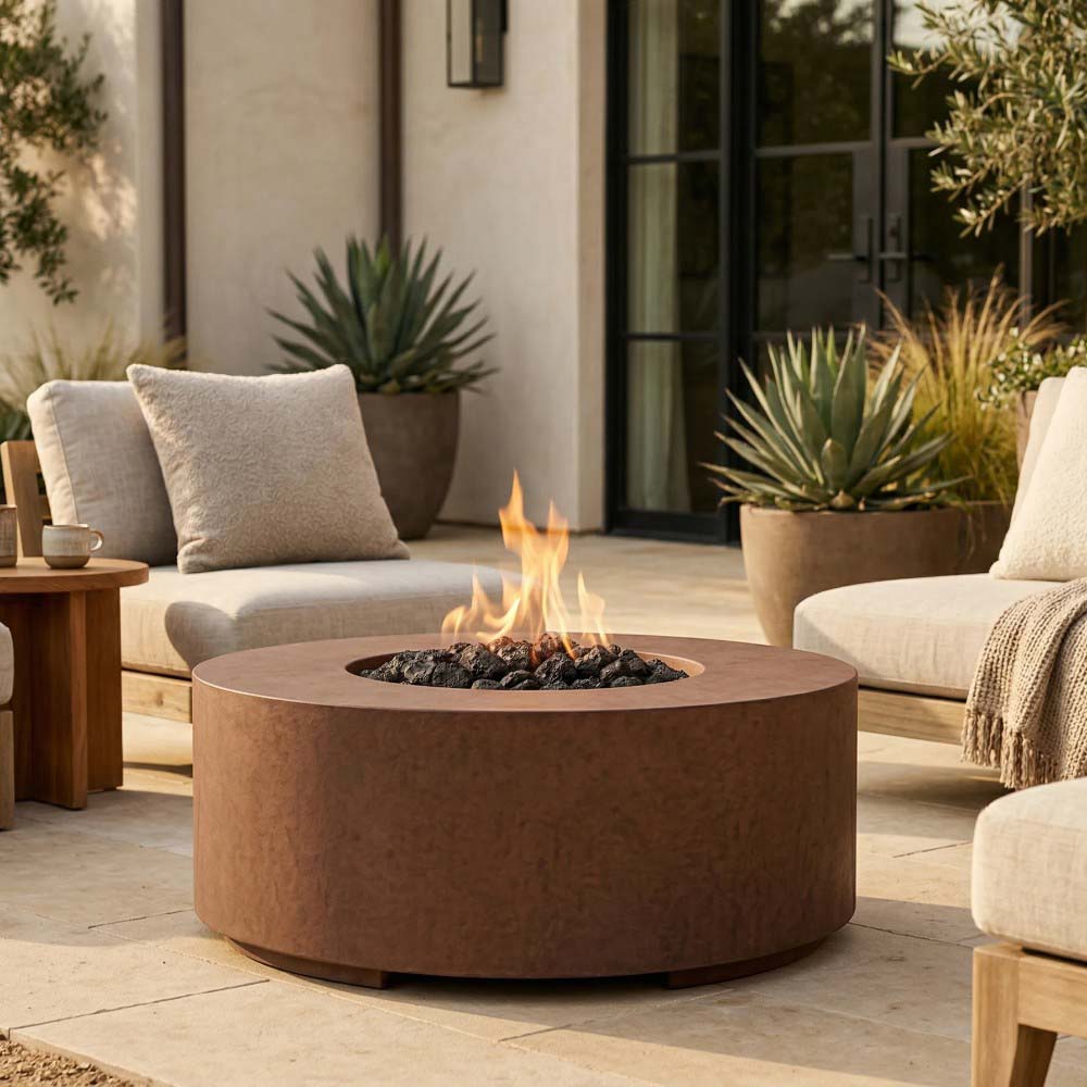 Brown round concrete gas fire pit with lit burner opening and flames