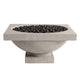 Natural light-gray concrete gas fire bowl filled with black lava rocks, side view