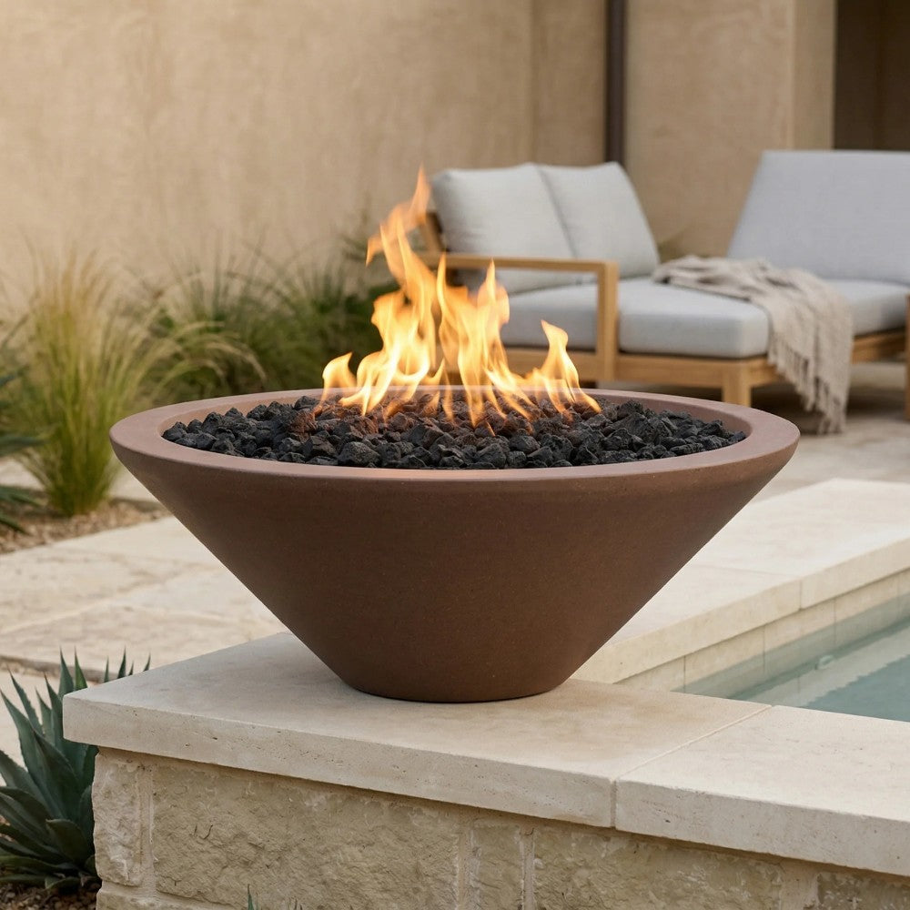 Concrete gas fire pit bowl with flame and black lava rocks in brown finish