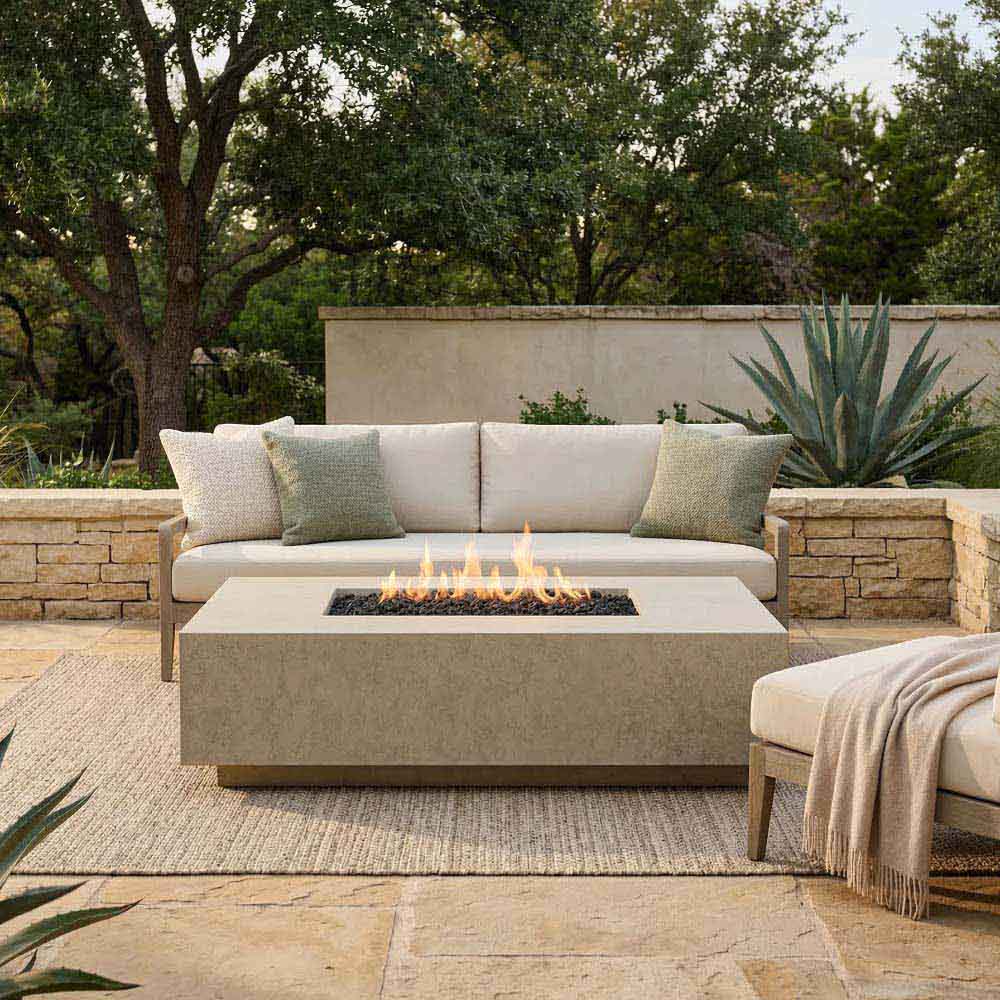 Rectangular concrete gas fire pit with visible flames in a square recessed burner
