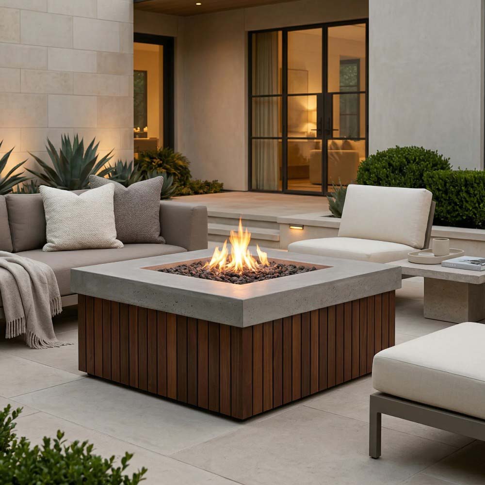 Prism Hardscapes Manchester concrete gas fire pit with flame, wood slat base, patio chairs