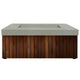 Light gray gas fire pit with wooden slat panels and rectangular burner opening in concrete top.