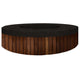 Round concrete gas fire pit with black speckled top and wood slat side panels