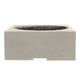 Concrete gas fire pit with open flame bowl and side handle cutout, beige sand finish.