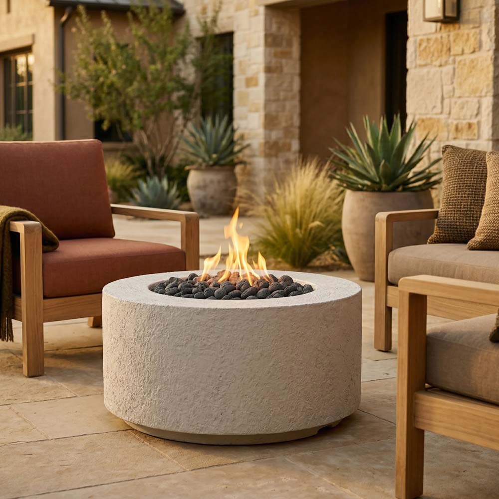 Stone-textured concrete gas fire pit with visible flame and decorative lava rocks