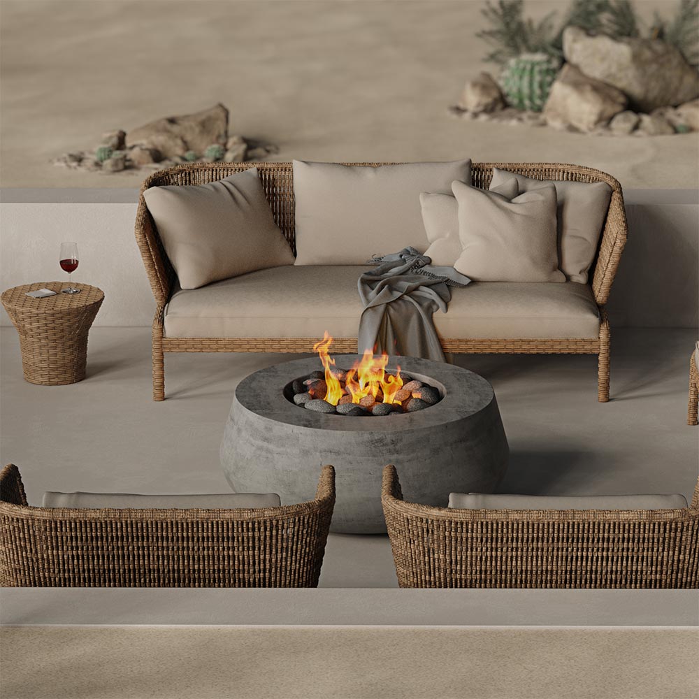 Concrete gas fire bowl with visible flames and black burner rocks