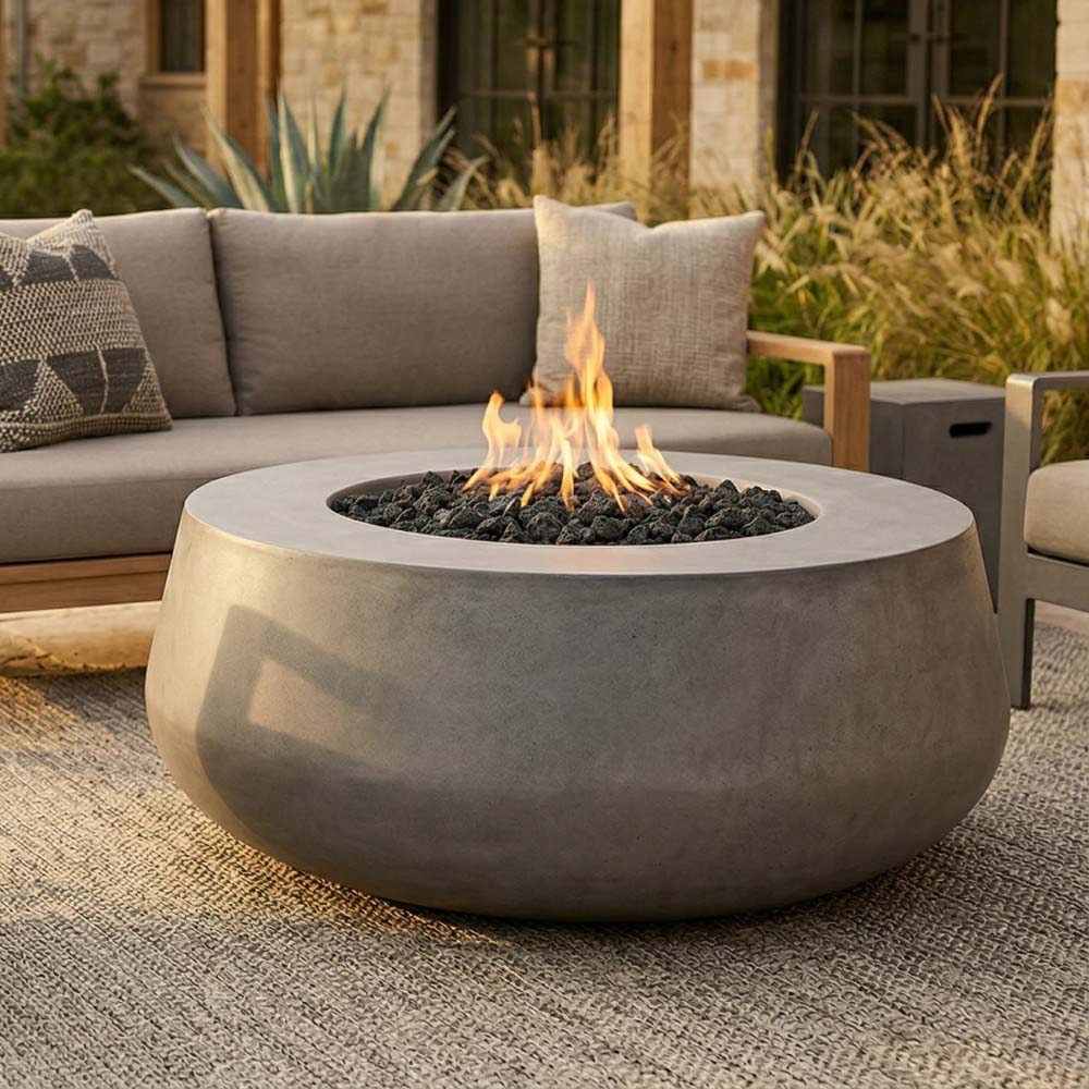 Light gray concrete gas fire bowl with centered flames and dark fire bed