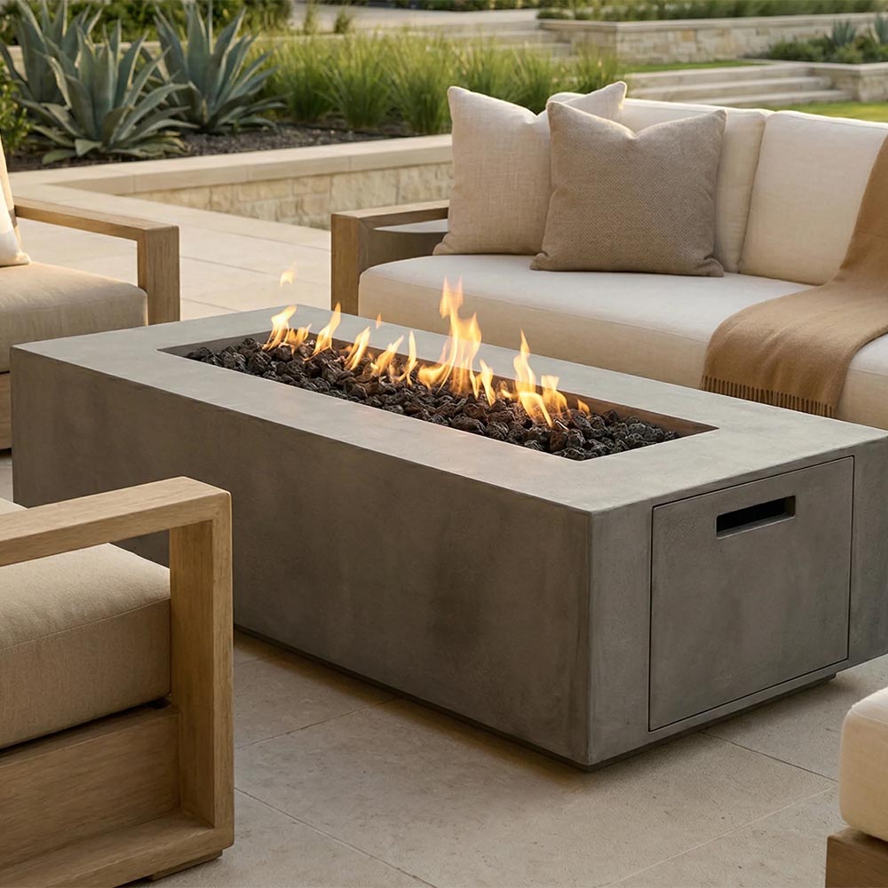 Rectangular concrete propane gas fire pit with flames and side access door, gray