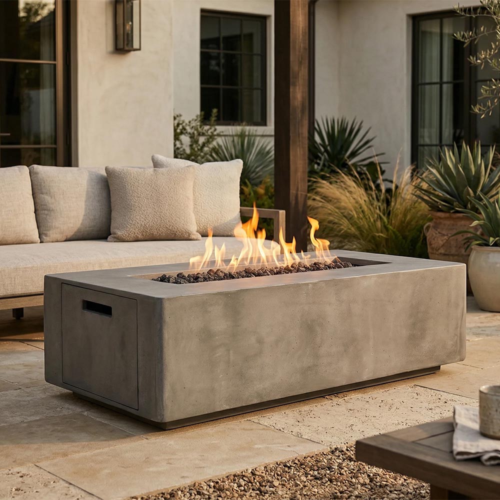 Rectangular concrete propane gas fire pit with open flames, gray stone finish