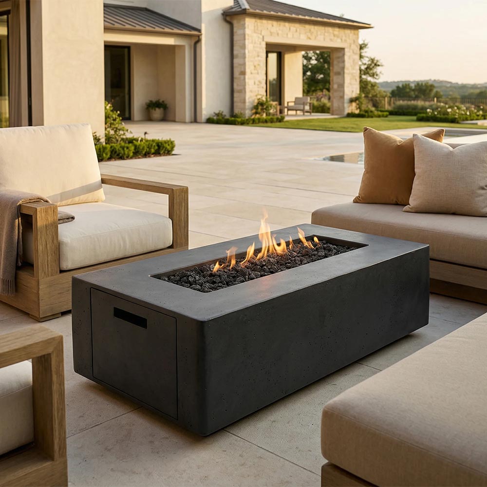 Rectangular concrete propane gas fire pit with flames and side access door, dark gray