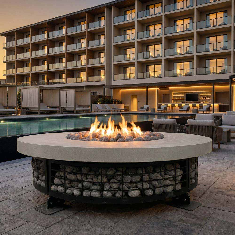 Round concrete gas fire pit with flames centered above the lava rock surround