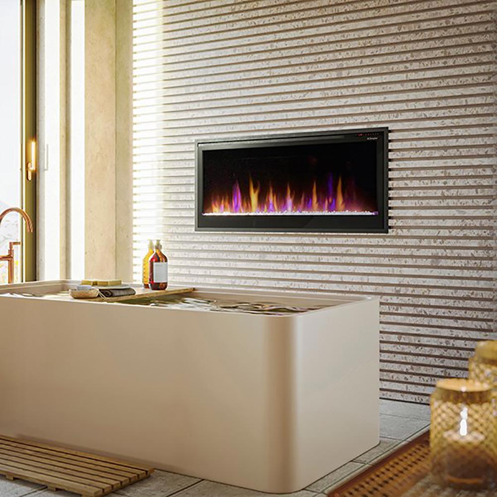 Built-in electric fireplace mounted in wall with slim black trim and flame glow