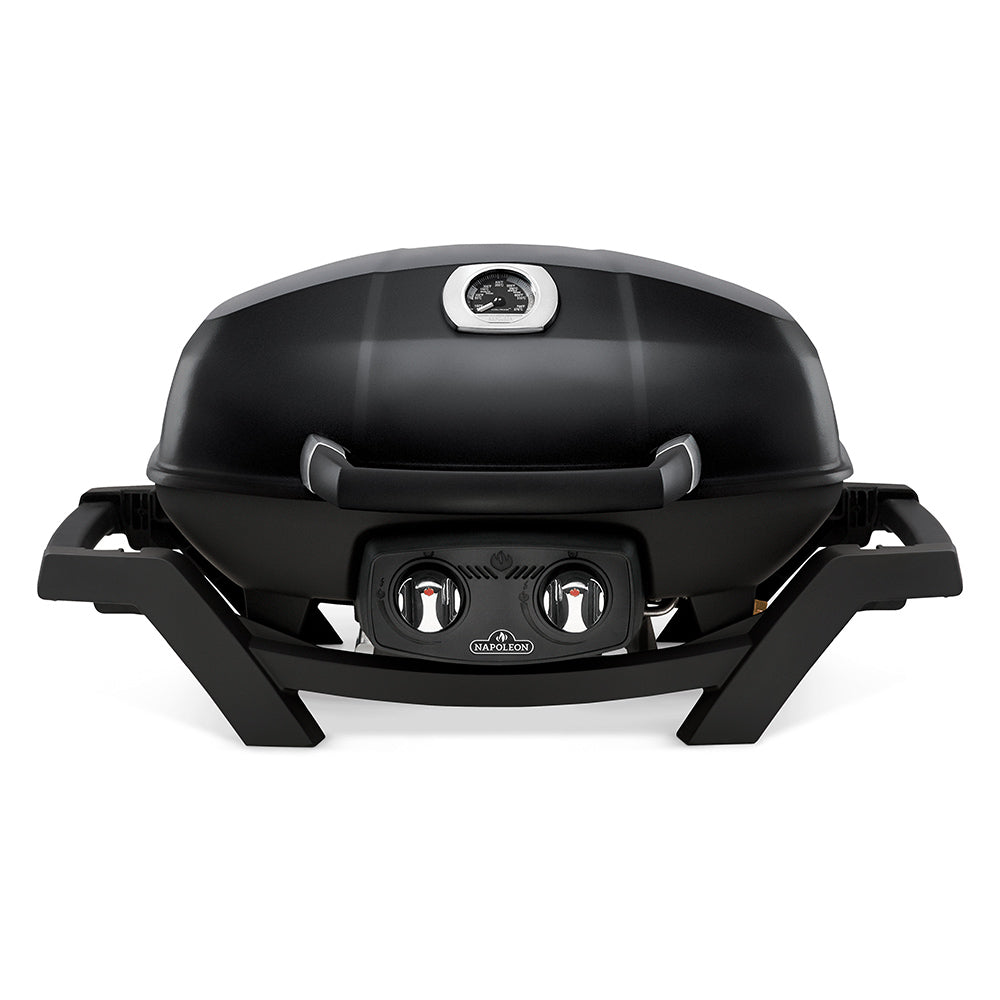 Portable tabletop gas grill, black hood and front control knobs, front view.