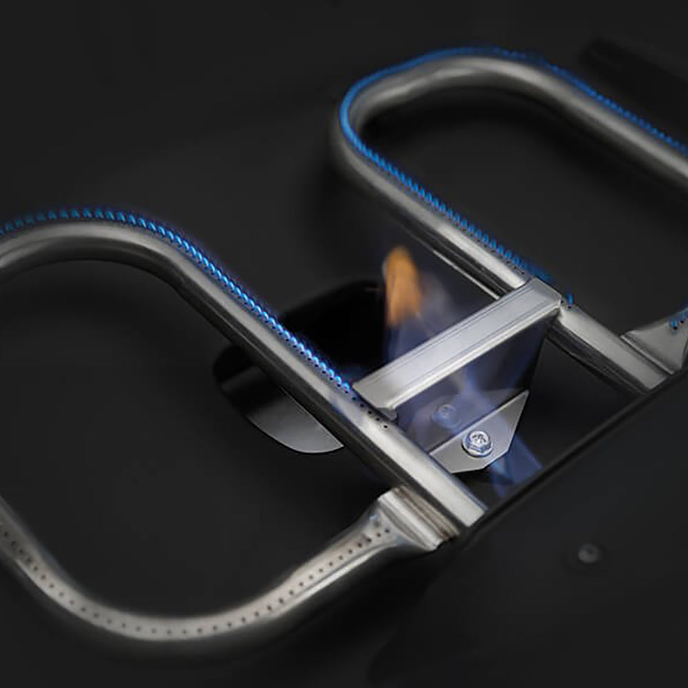 Grill ignition area with blue-highlighted wire and metal burner supports