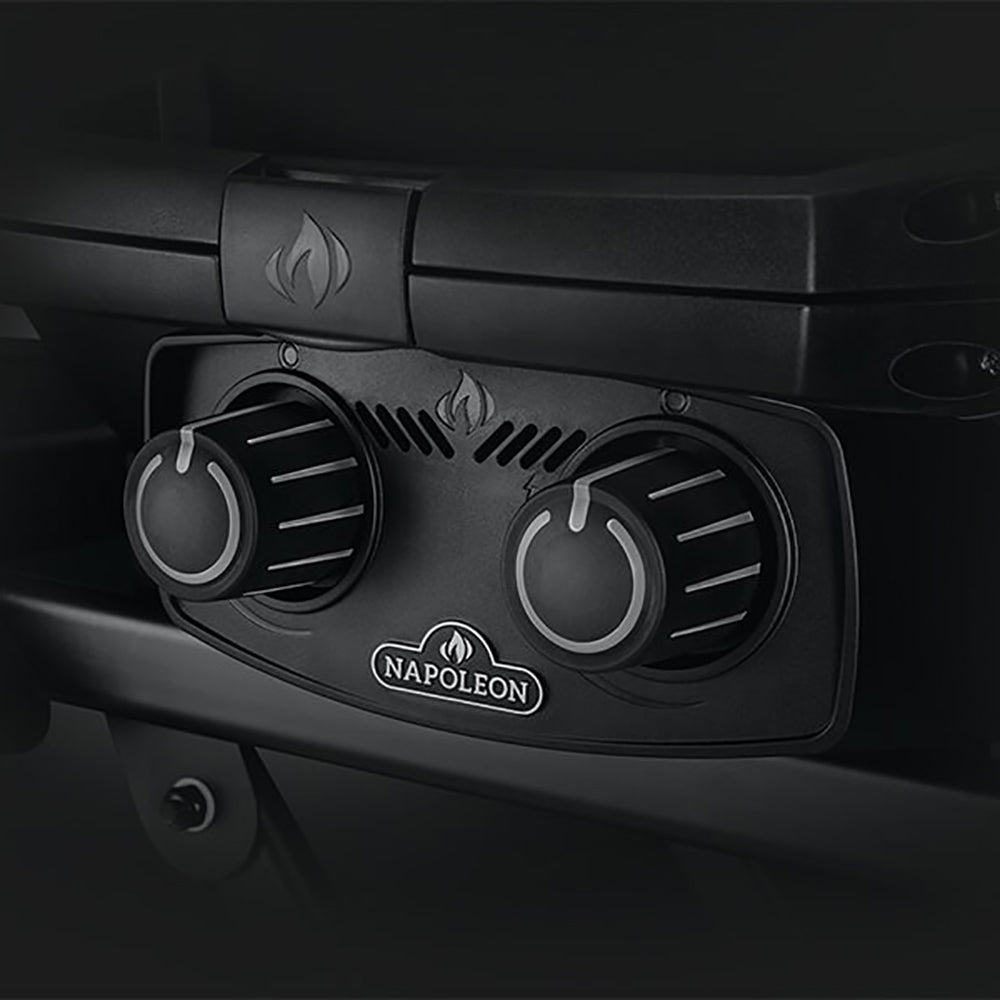 Grill control knobs with flame icons and Napoleon logo on control panel