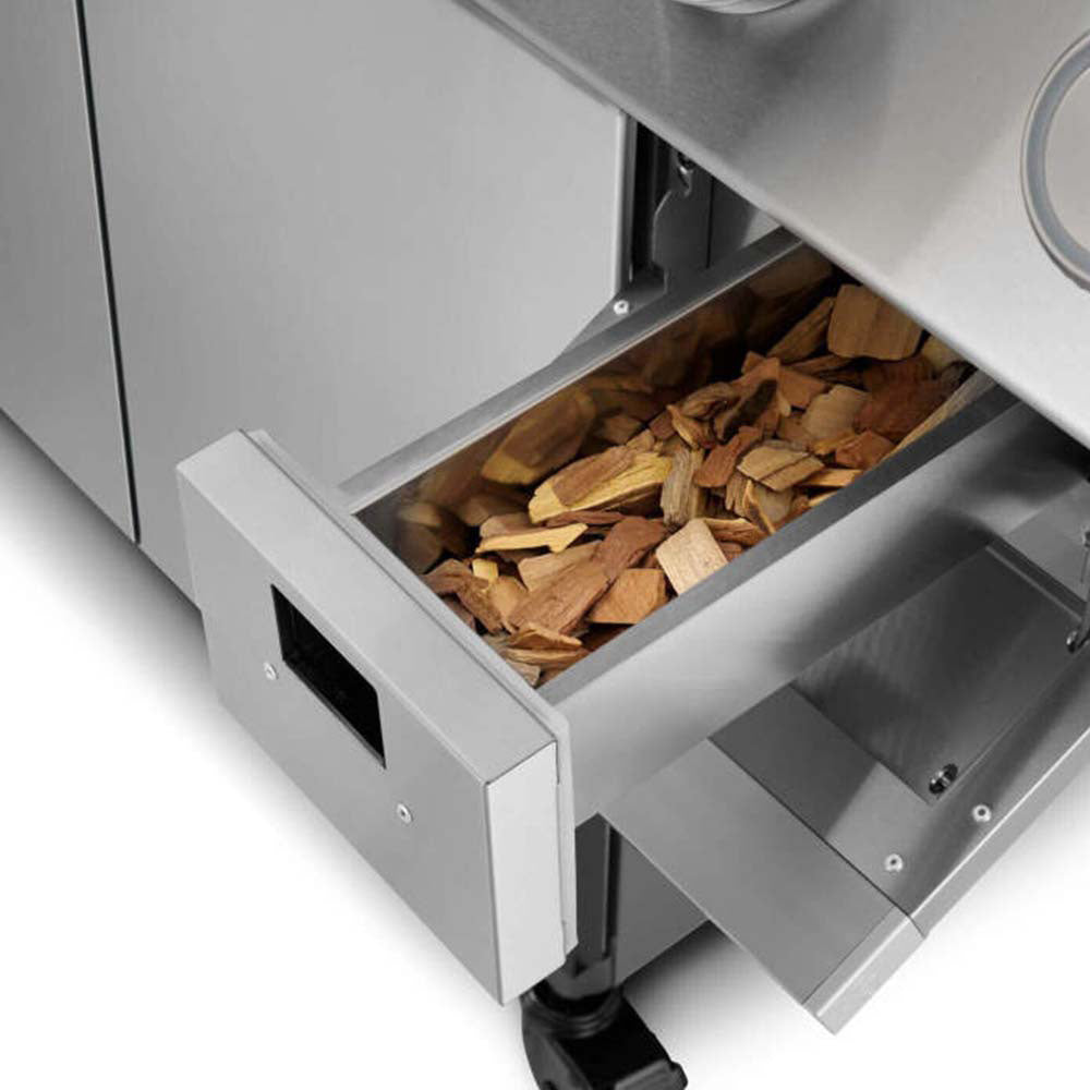 Stainless steel smoker box drawer filled with wood chips