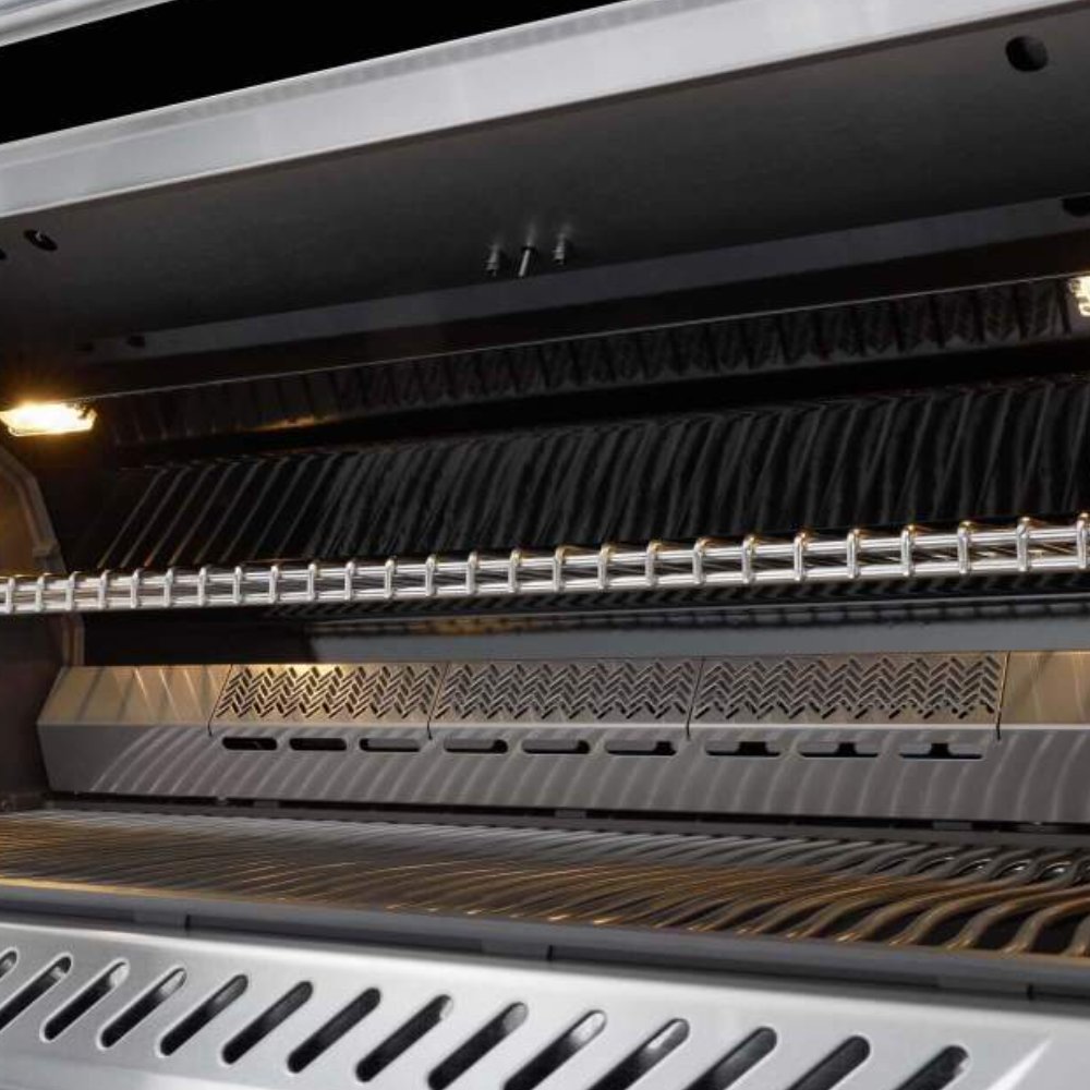 Open gas grill hood with stainless heat baffle and warming rack above