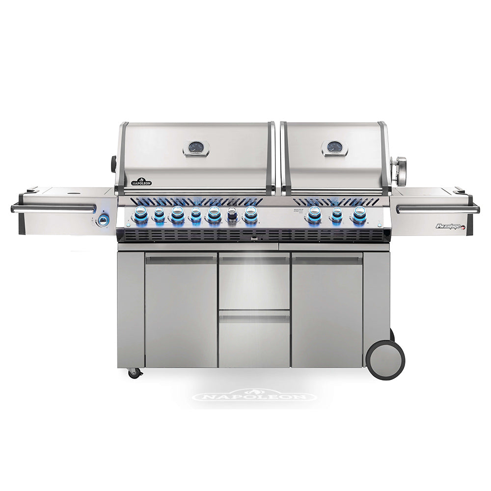 Gas grill on cart with stainless-steel body, control knobs, and side shelf