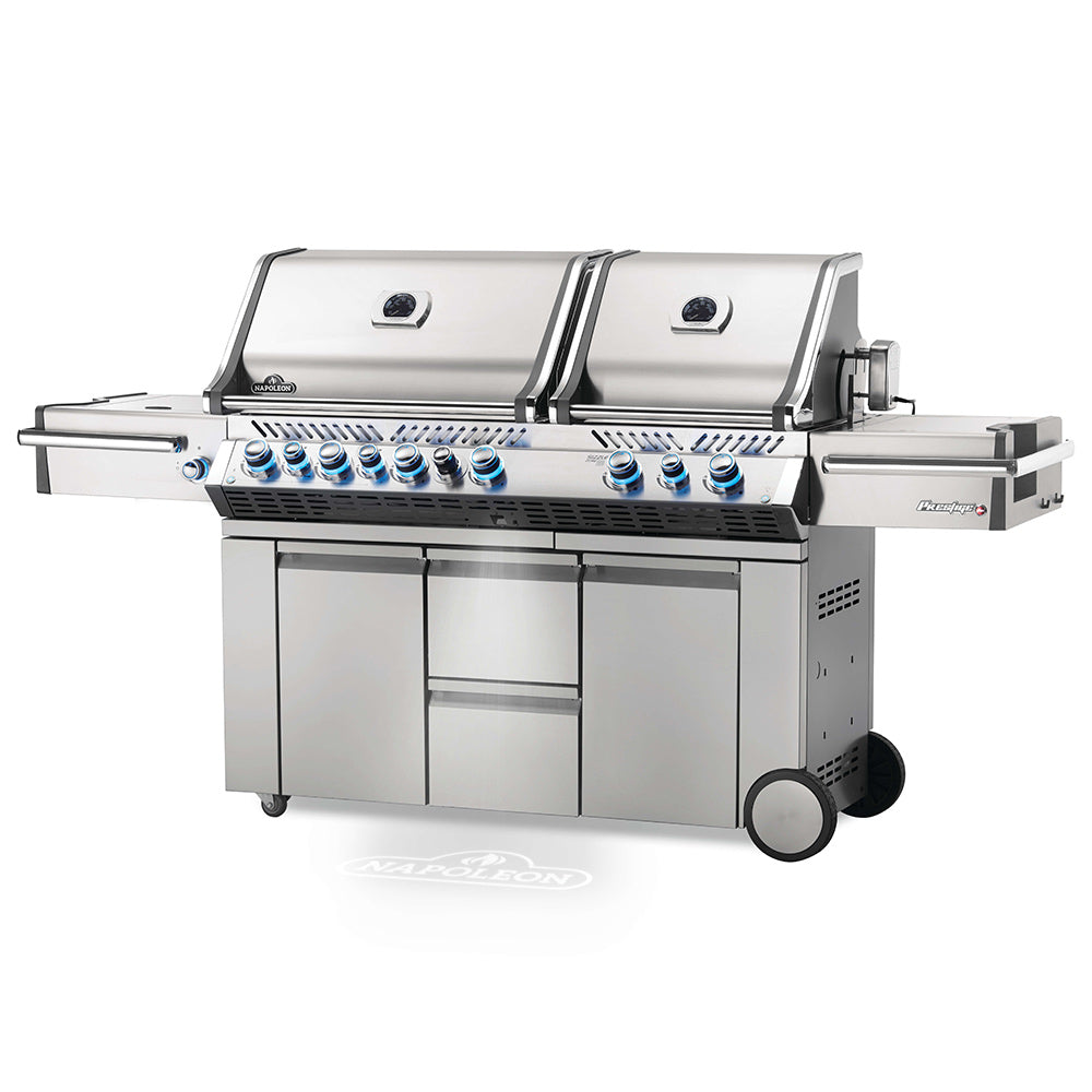 Gas grill on cart with stainless-steel hood, burner controls, and side shelf