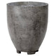 Concrete gas fire pit with round drum shape, medium gray speckled finish, vented top panel