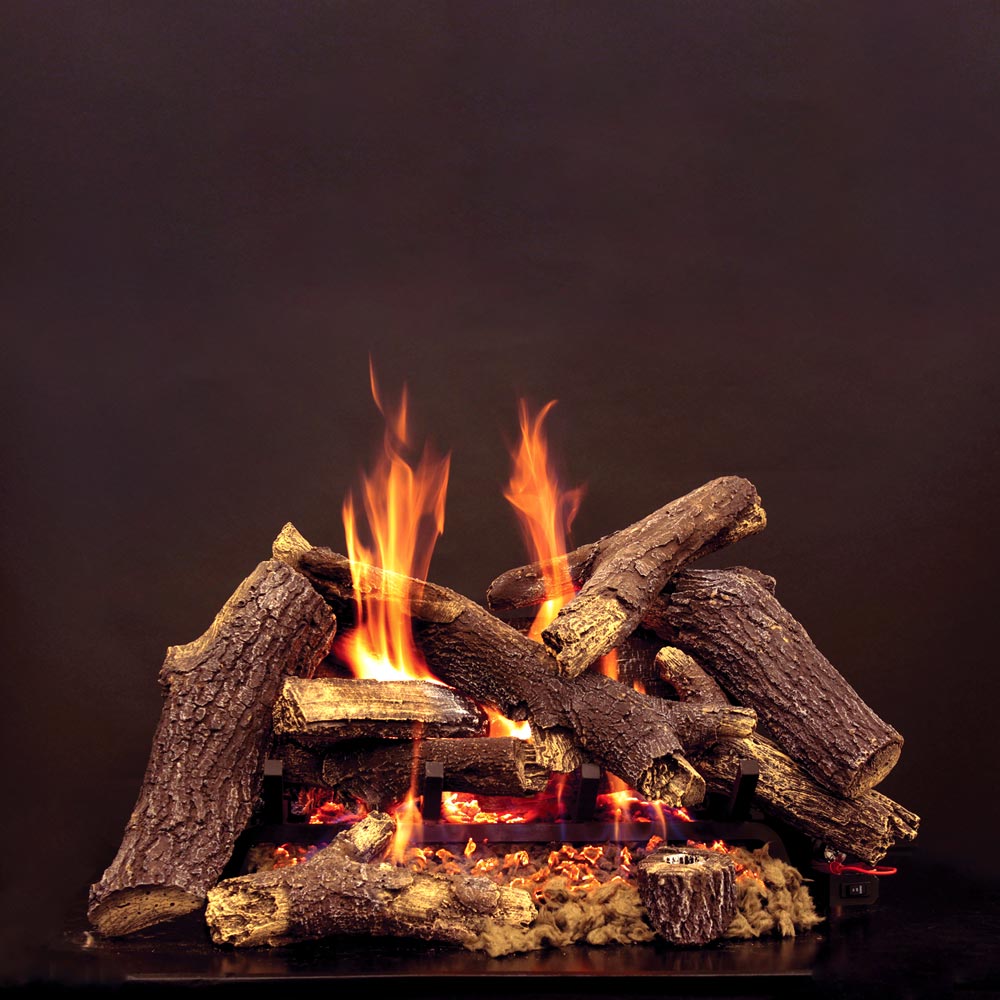 Gas fireplace log set with glowing embers and burning wood-effect logs