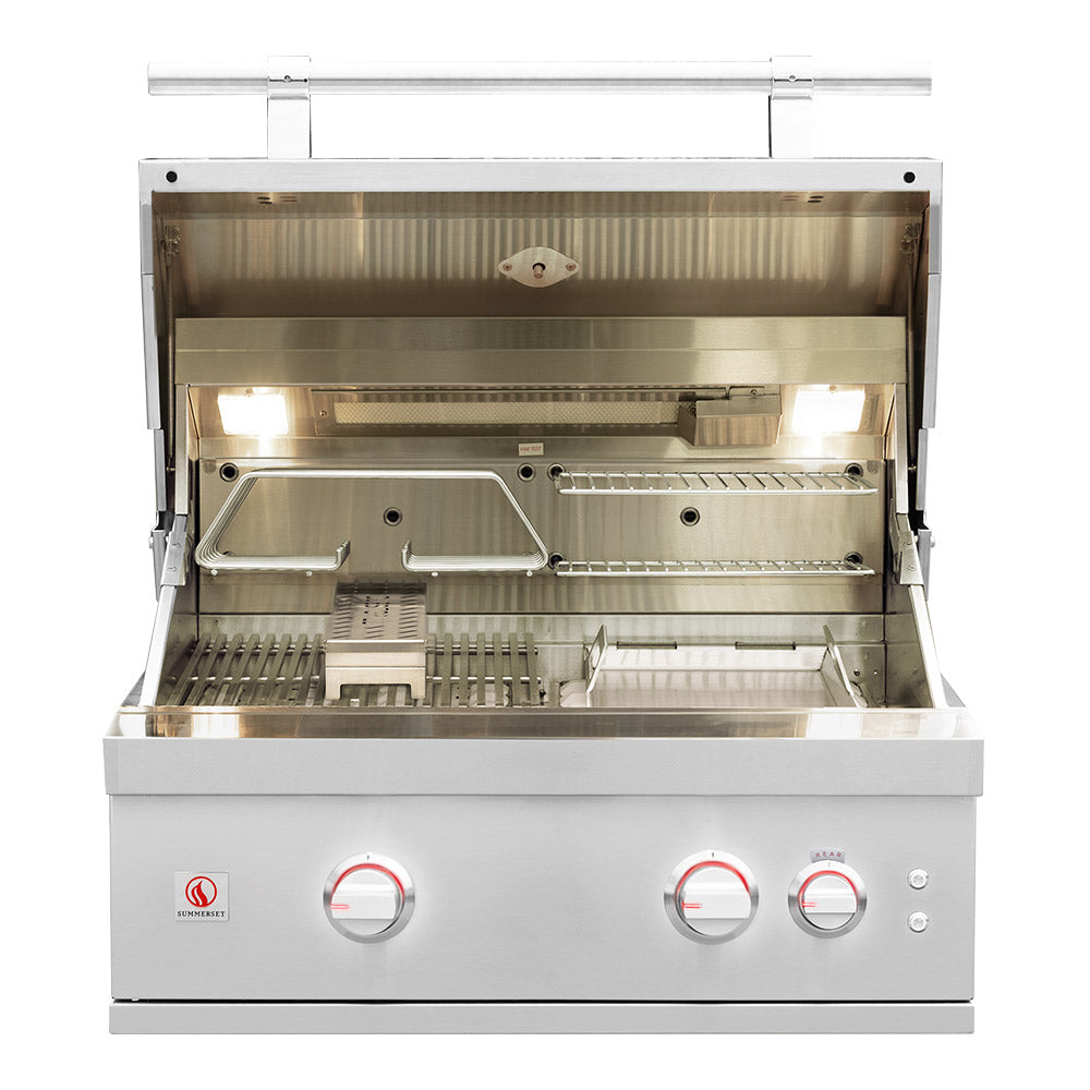 Open built-in gas grill showing burners and cooking area in stainless steel