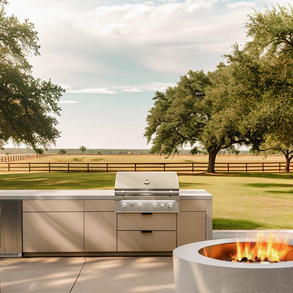 Stainless steel built-in gas grill with side controls in outdoor island