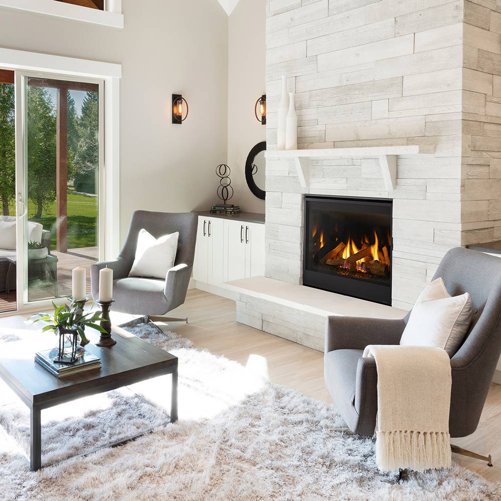 Built-in gas fireplace with black surround and fire burning in stone-look firebox