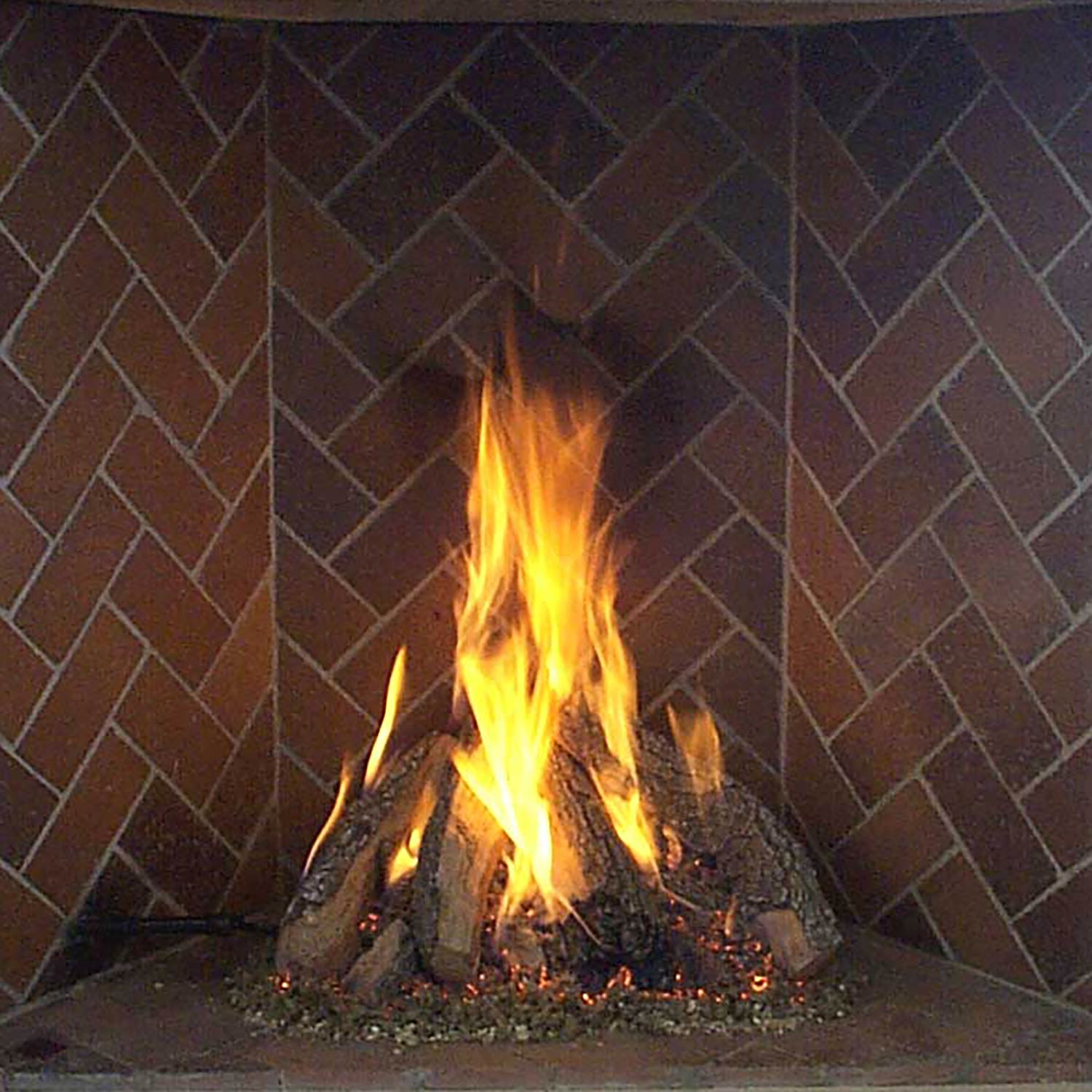 Fireplace log set with stacked burning logs and bright flames
