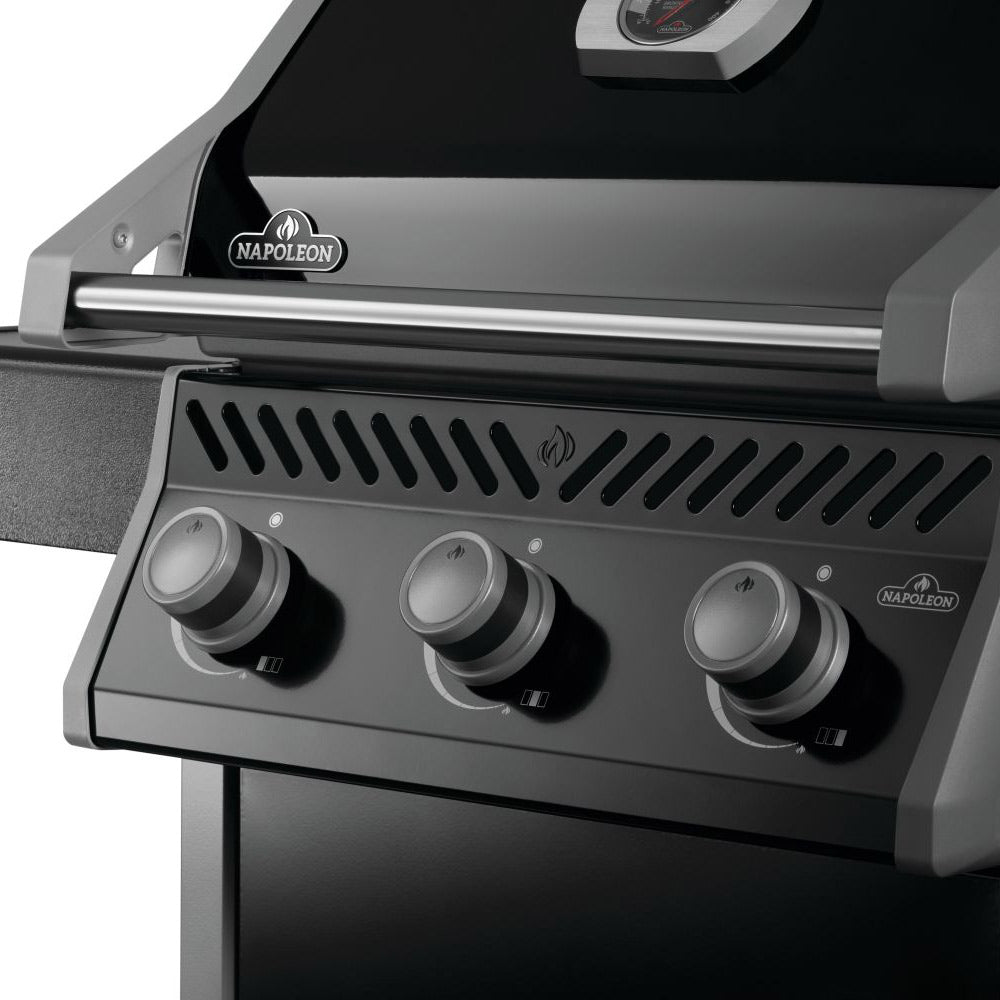 Napoleon Rogue 425 gas grill control panel close-up with 3 knobs and vented hood