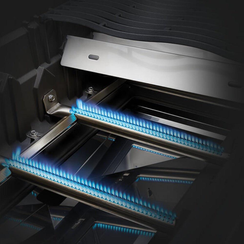 Gas grill interior showing multiple blue-lit burner tubes