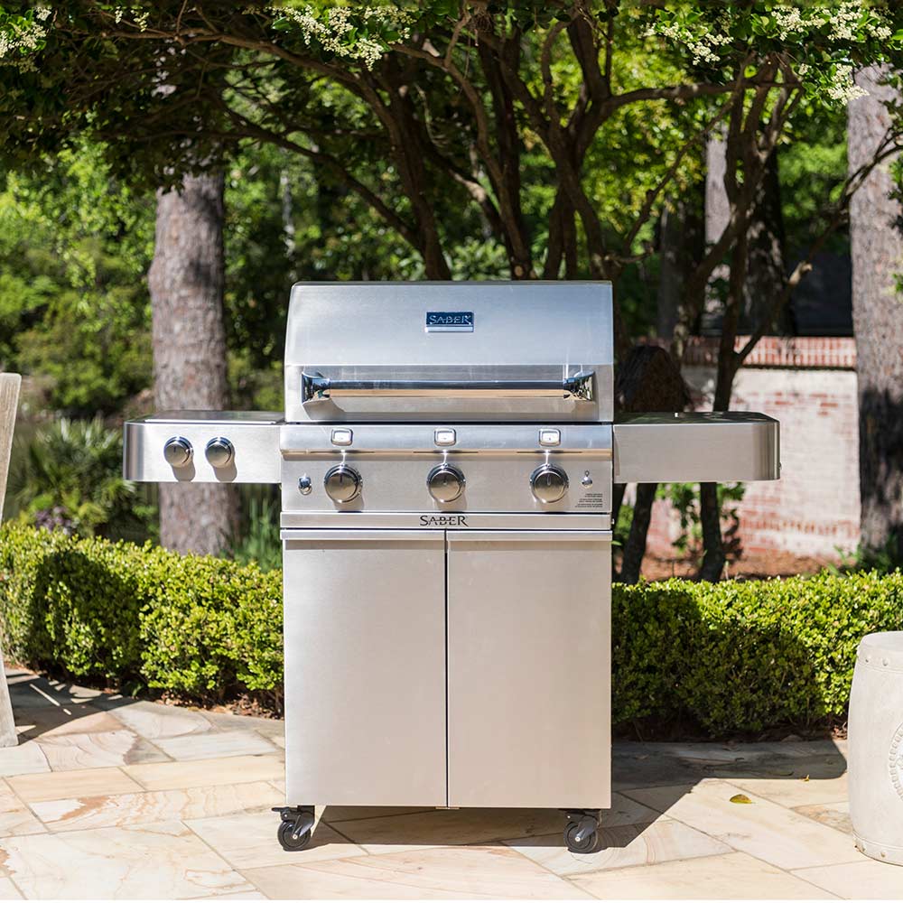 Freestanding 3-burner infrared grill with side burner, lid closed, front control panel
