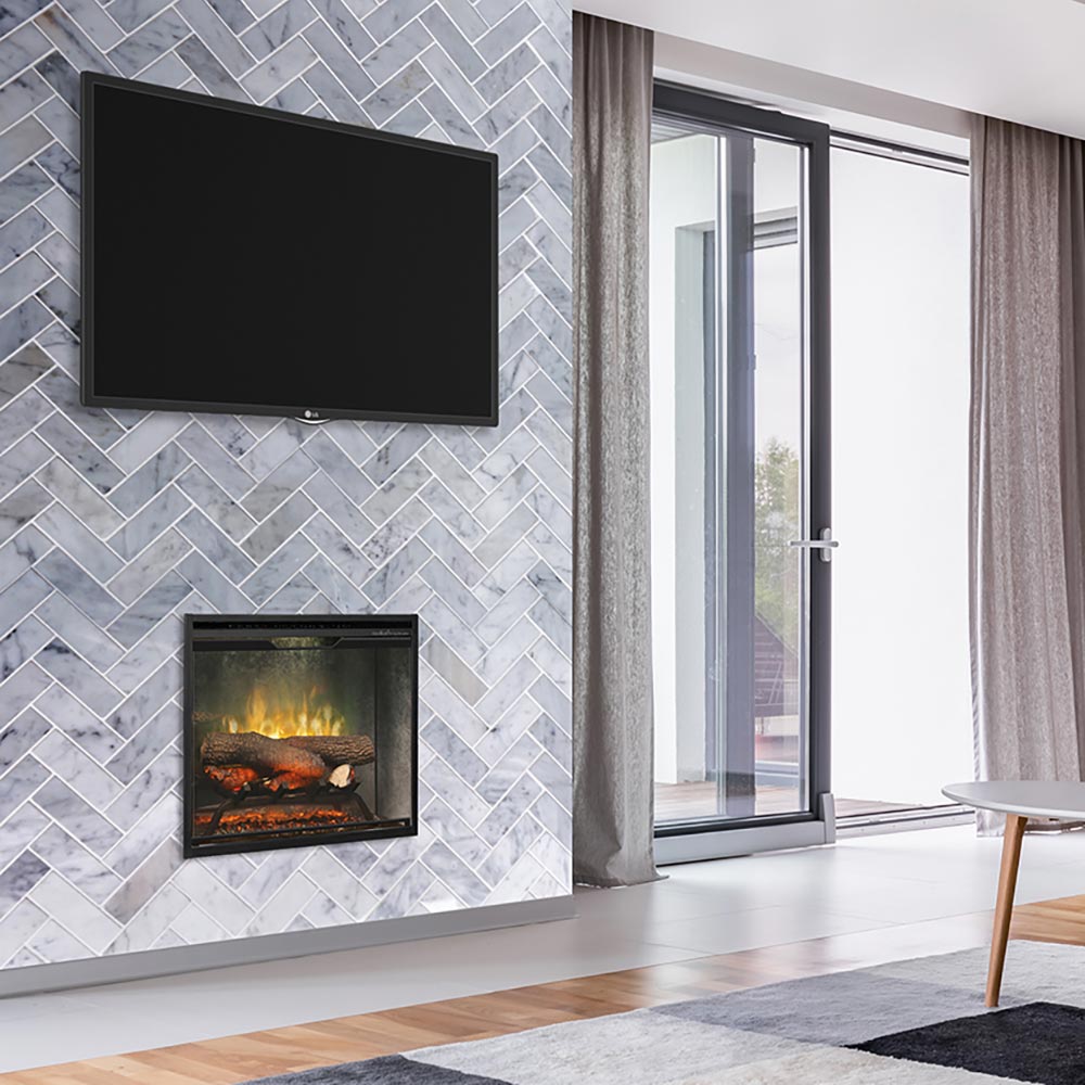 Electric fireplace insert with black frame on gray brick wall