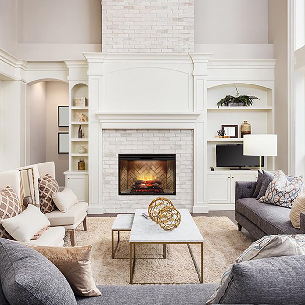 Built-in electric fireplace with glass viewing window and glowing log-style flame effect in white surround