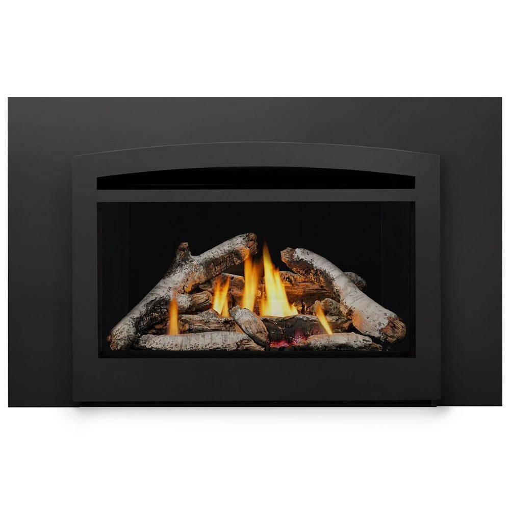 Gas fireplace insert with black surround and burning logs with tall flames behind glass