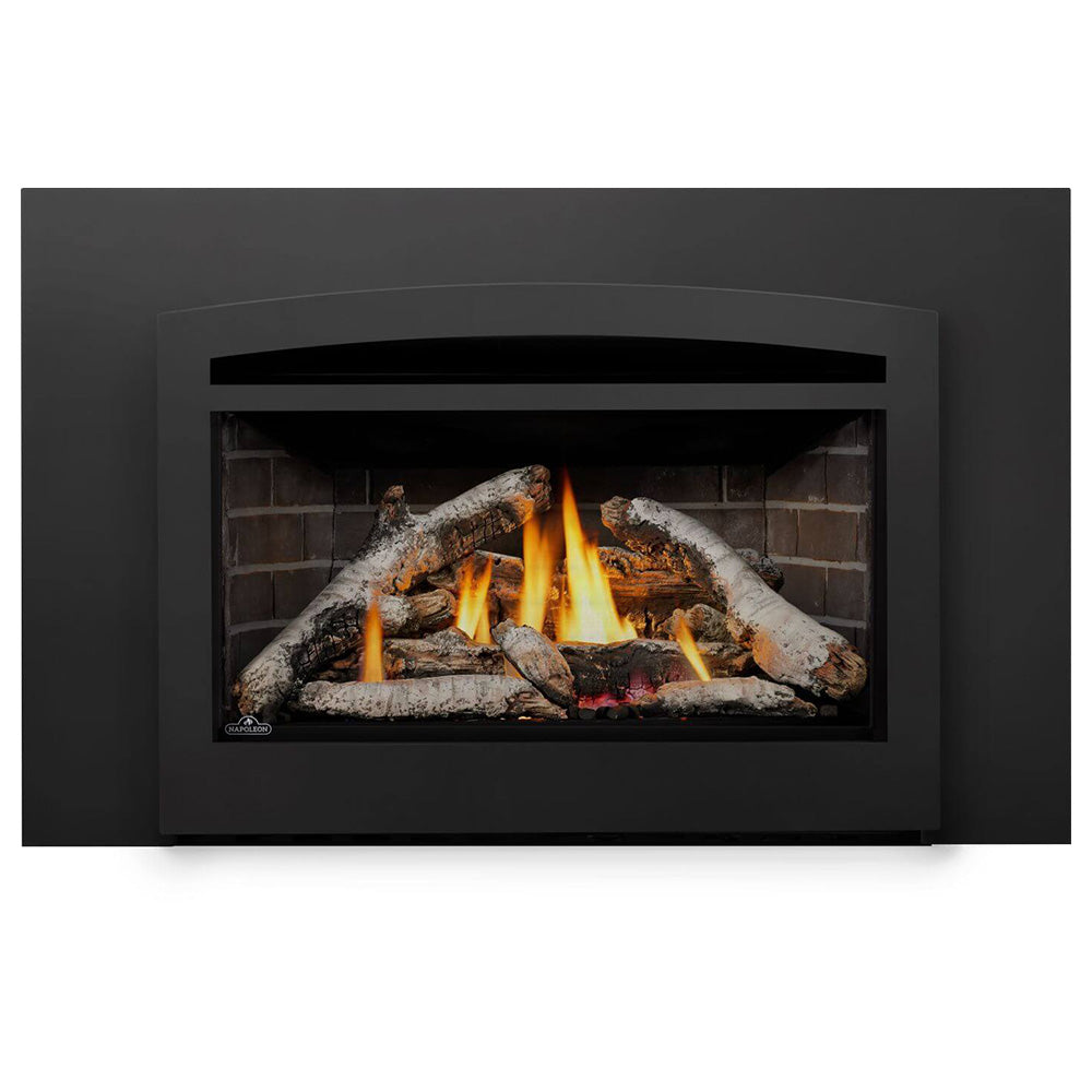 Black direct vent gas fireplace insert showing logs and flames in the firebox