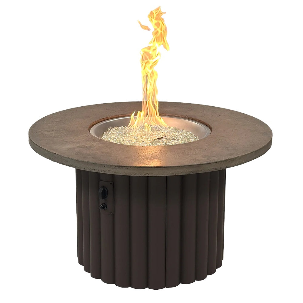 Round gas fire pit table with brown round top and dark ribbed base, flames in center