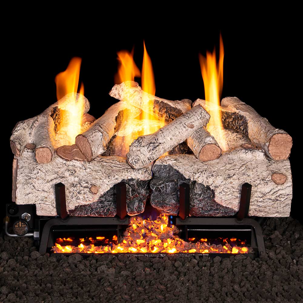 Ventless gas log set with charred birch logs and glowing flames in a firebox