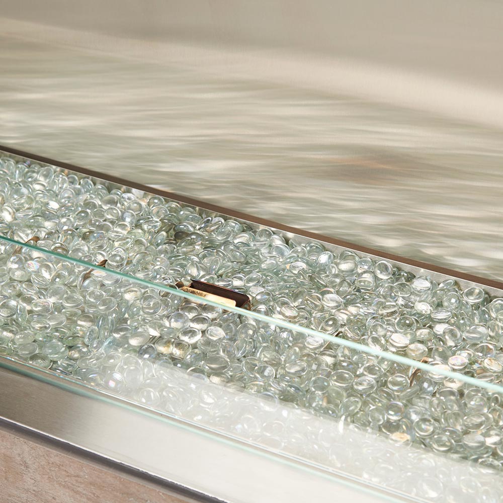 Linear fireplace burner with clear fire glass media