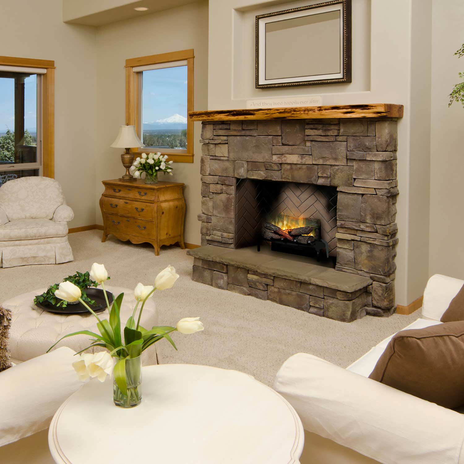 Plug-in electric log set in stone fireplace with faux logs and yellow flame glow