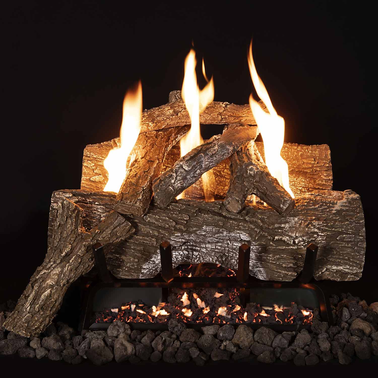 Vent-free gas log set with tall flames, stacked logs on metal grate over dark gravel