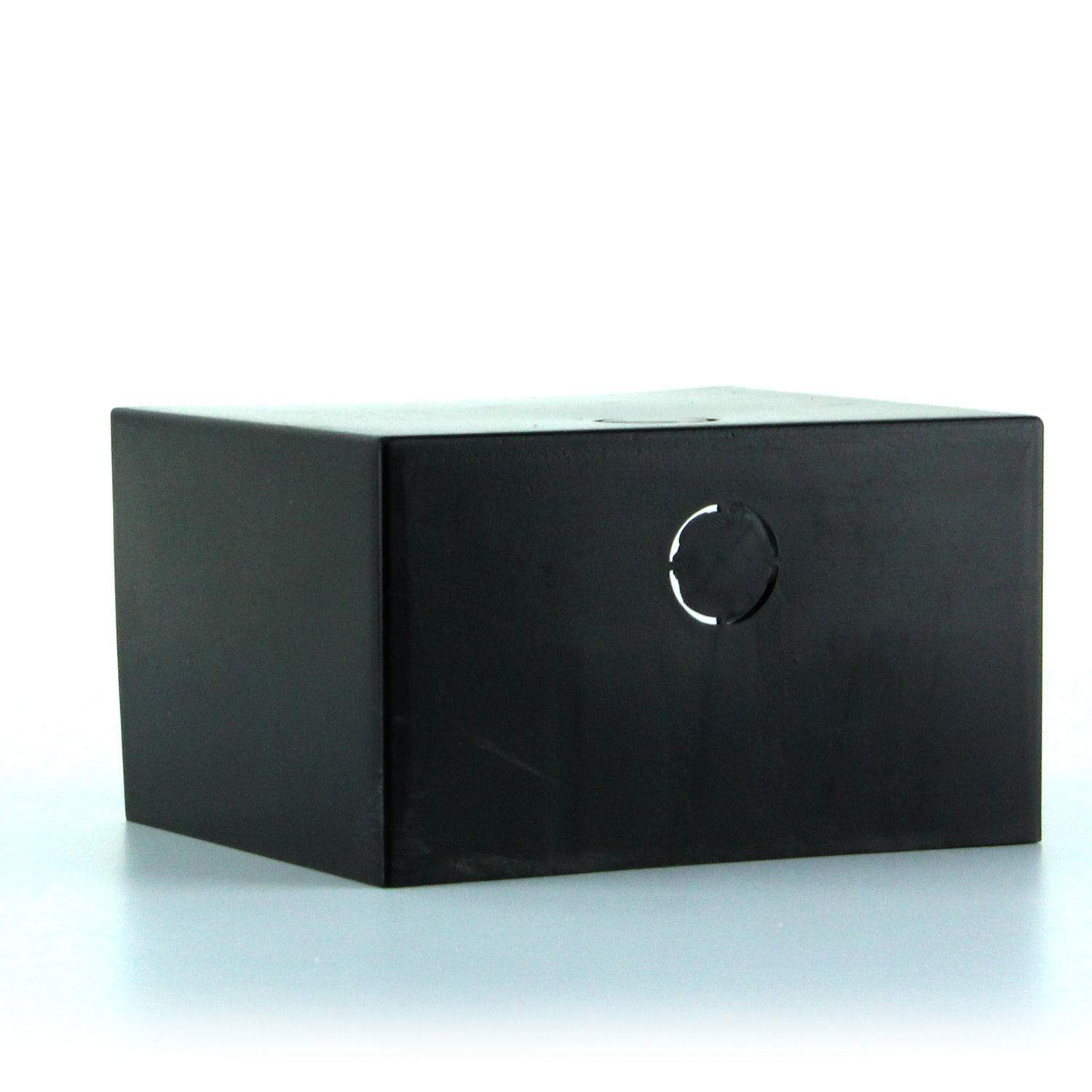 Black receiver cover with circular latch detail on front