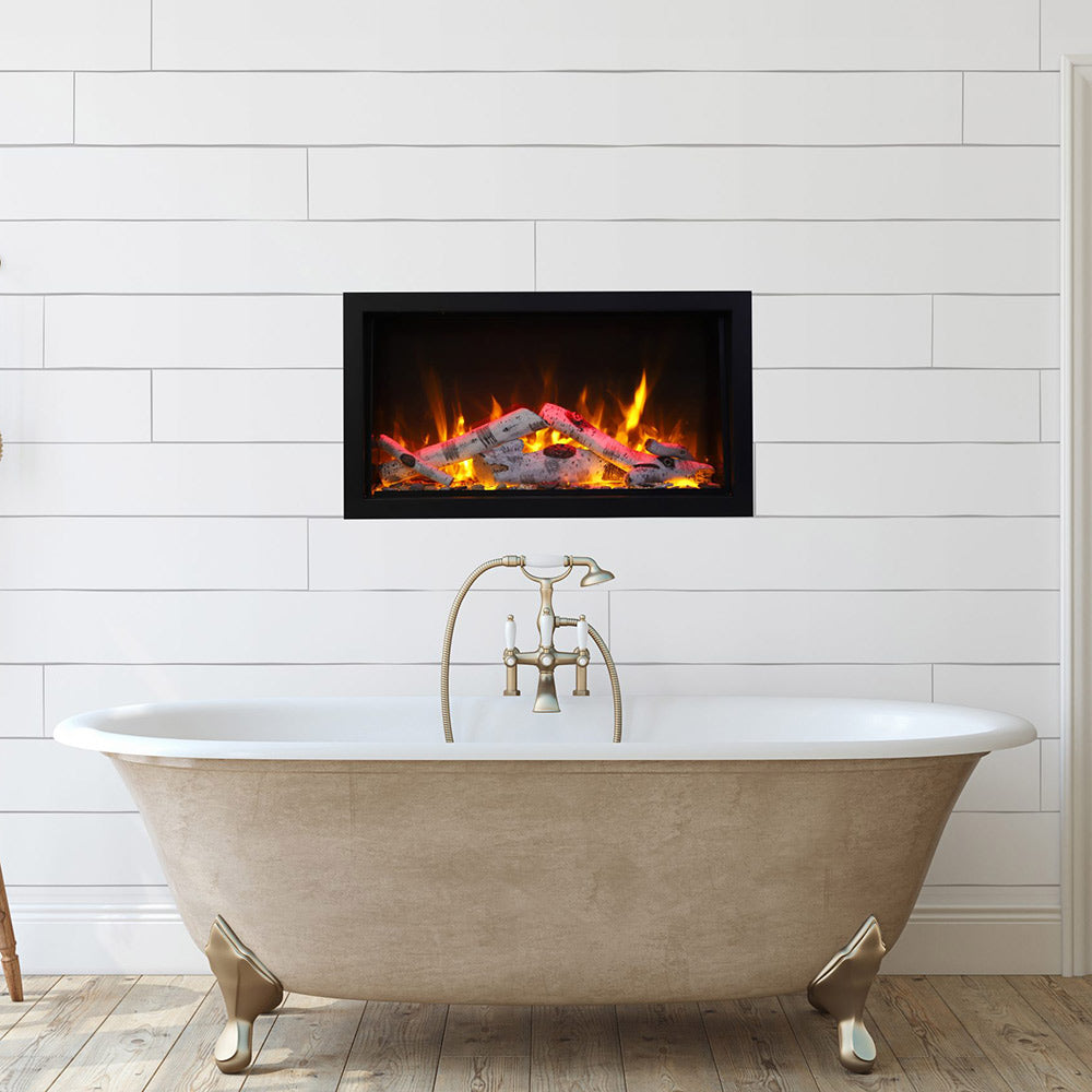 Black electric fireplace insert with glowing logs and visible flame effect